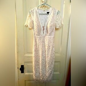 Beautiful white lace wedding style dress.